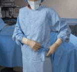 securing surgical gown before procedur